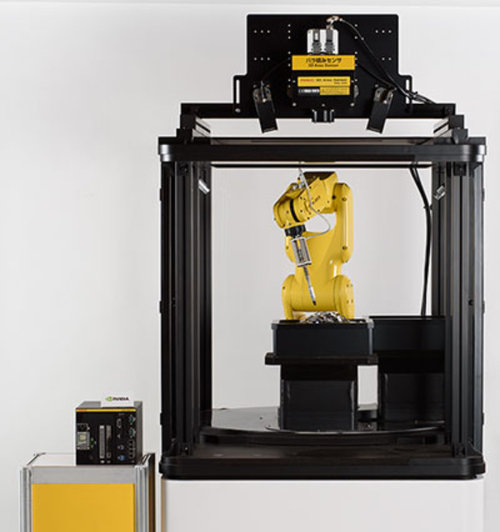 写真1●バラ積みセンサー付ロボットシステム（デモ機）